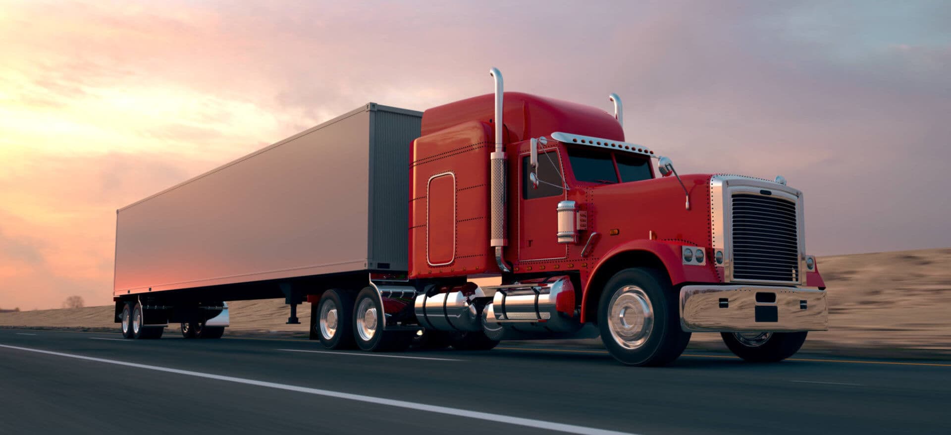 red truck running while the sun is setting down