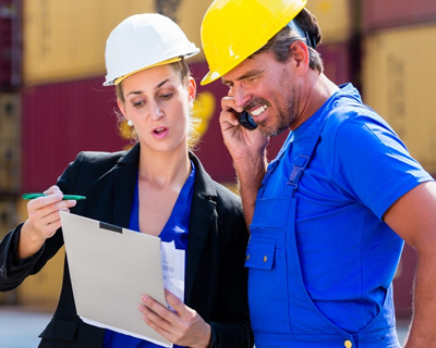 two logistics employees having a discussion